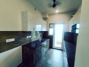 Kitchen in 3.5 BHK Apartment at Elite Golf Green, Sector 79 – for Rent