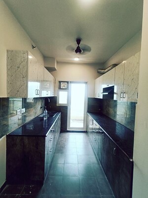 Kitchen in 3.5 BHK Apartment at Elite Golf Green, Sector 79 – for Rent
