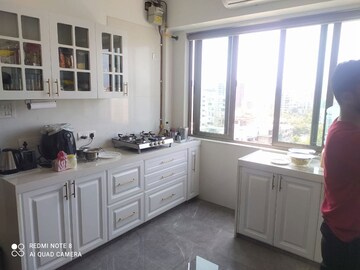 Kitchen in 3 BHK Apartment at KM Mid Summer CHS, Santacruz West – for Rent