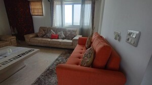 Living Room in 4 BHK Apartment at Emaar The Palm Drive-Palm Studios, Sector 66 – for Rent