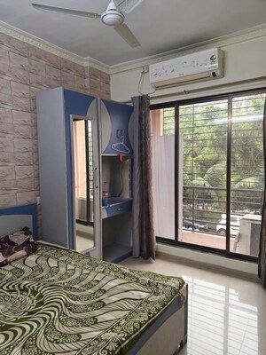 Bedroom in 2 BHK Apartment at Oracle Sapphire CHS, Nerul – for Rent