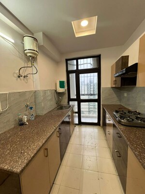 Kitchen in 2 BHK Apartment at Ansal Sushant Media Enclave, Sushant Golf City – for Rent