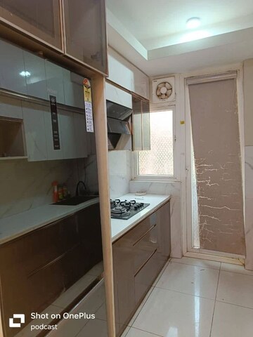 Kitchen in 2 BHK Apartment at Mahagun Mywoods, Sector 16c Greater Noida – for Rent