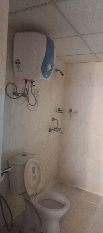 Bathroom in 2 BHK Apartment at Aims Golf City, Sector 75 – for Rent