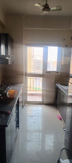 Kitchen in 2 BHK Apartment at Aims Golf City, Sector 75 – for Rent