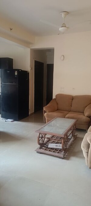 Living Room in 2 BHK Apartment at Aims Golf City, Sector 75 – for Rent