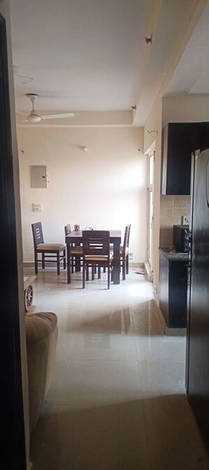 Living Room in 2 BHK Apartment at Aims Golf City, Sector 75 – for Rent