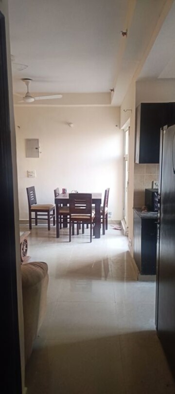 Living Room in 2 BHK Apartment at Aims Golf City, Sector 75 – for Rent