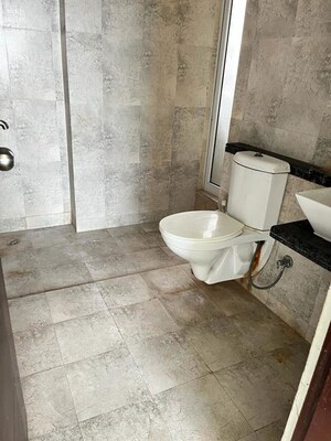 Bathroom in 3 BHK Apartment at Mahagun Mirabella Highrise, Sector 79 – for Sale