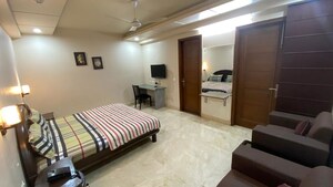 Bedroom in 4 BHK Builder Floor at South Extension I – for Rent
