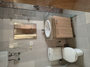 Bathroom in Studio Apartment at Nimbus The Golden Palm, Sector 168 – for Rent