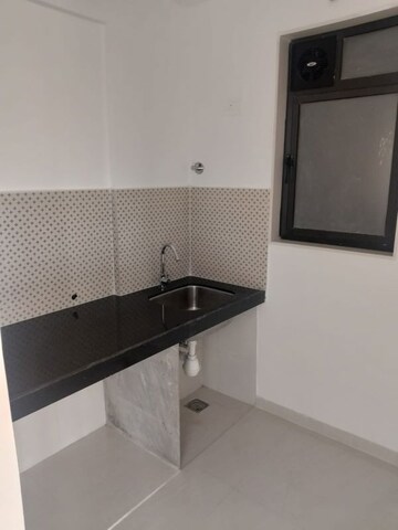 Kitchen in 2 BHK Apartment at Cosmos Empress Park, Ghodbunder Road – for Rent