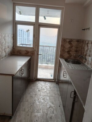 Kitchen in 2.5 BHK Apartment at Amrapali Riverview, Amrapali Leisure Valley – for Rent