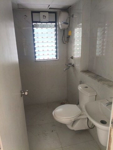Bathroom in 1 BHK Apartment at Runwal Gardens Phase I, Dombivli East – for Rent