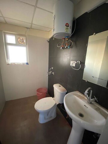 Bathroom in 3 BHK Apartment at Aims Golf City, Sector 75 – for Rent