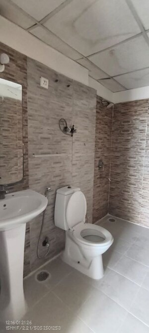 Bathroom in 3.5 BHK Apartment at Aims Golf City, Sector 75 – for Rent