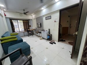 Living Room in 1 BHK Apartment at Kopar Khairane – for Sale