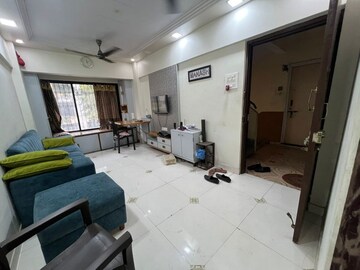 Living Room in 1 BHK Apartment at Kopar Khairane – for Sale