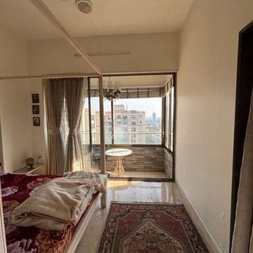 Bedroom in 3 BHK Apartment at Poseidon Apartment, Yari Road – for Rent
