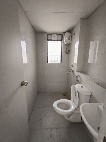 Bathroom in 1 BHK Apartment at Runwal Gardens, Dombivli East – for Rent