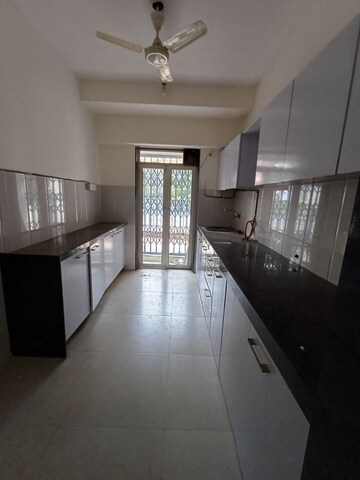 Kitchen in 3 BHK Apartment at Conwood Enclave, Vasant Vihar – for Rent