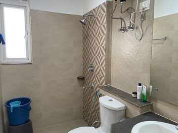 Bathroom in 3 BHK Apartment at ATS Homekraft Pious Hideaways, Sector 150 – for Rent