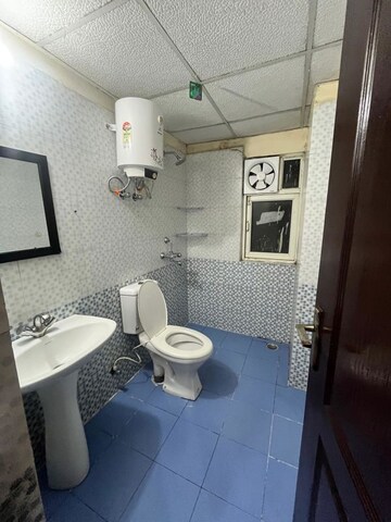 Bathroom in 3 BHK Apartment at Aims Golf City, Sector 75 – for Rent
