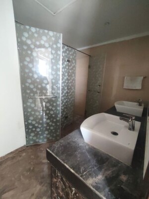 Bathroom in 3 BHK Apartment at Mahagun Mezzaria, Sector 78 – for Sale