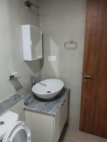 Bathroom in 1 RK Apartment at Bhartiya City Nikoo Homes 4, Thanisandra Main Road – for Rent