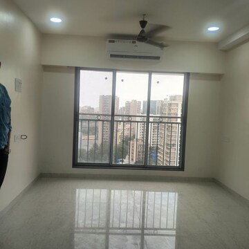 Living Room in 2 BHK Apartment at Pratham ARC Aura, Andheri West – for Rent
