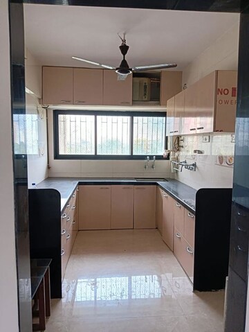 Kitchen in 3 BHK Apartment at Savita Nagar CHS, Louis Wadi – for Sale