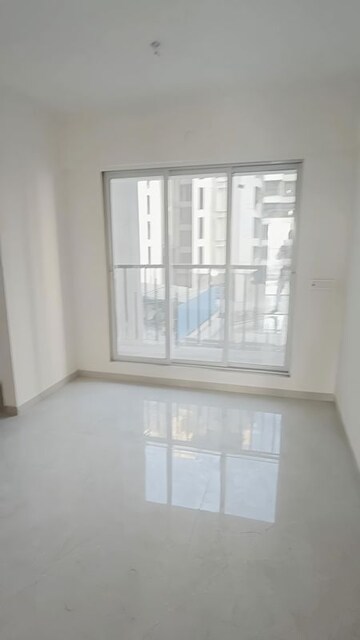 Living Room in 1 BHK Apartment at Rajlaxmi Nakshatra Auris, Nalasopara West – for Sale