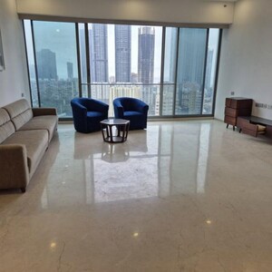 Living Room in 4 BHK Apartment at Rustomjee Crown, Gokhale Road – for Sale