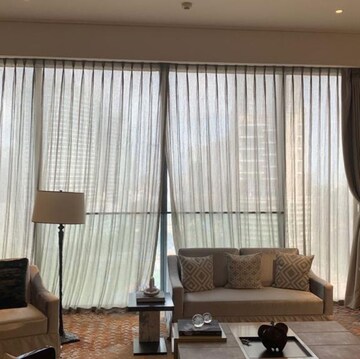 Living Room in 4 BHK Apartment at Rustomjee Crown, Gokhale Road – for Sale