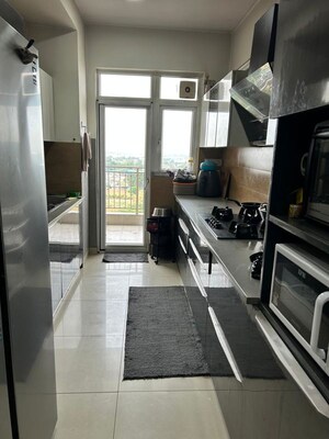 Kitchen in 3.5 BHK Apartment at Emaar Palm Gardens, Sector 83 – for Rent