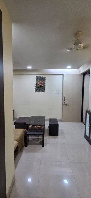 Living Room in 1 BHK Apartment at Kopar Khairane – for Sale