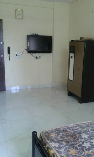 Tv Room in 2 BHK Apartment at Manju Tower CHS, Andheri West – for Rent