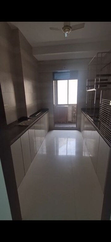 Kitchen in 2 BHK Apartment at Asmita Sand Dunes, Malad West – for Rent