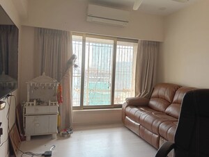 Living Room in 3 BHK Apartment at Romell Diva, Malad West – for Rent