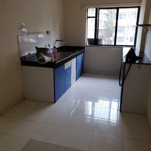 Kitchen in 2 BHK Apartment at Sai Dwarkamai CHS, Nibm – for Rent