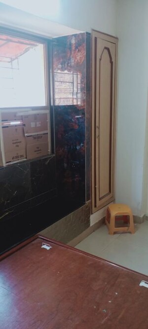 Living Room in 1 BHK Apartment at Bindra Complex, Andheri East – for Rent