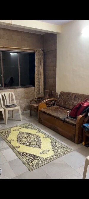 Living Room in 1 BHK Apartment at Kirit CHS, Malad West – for Rent