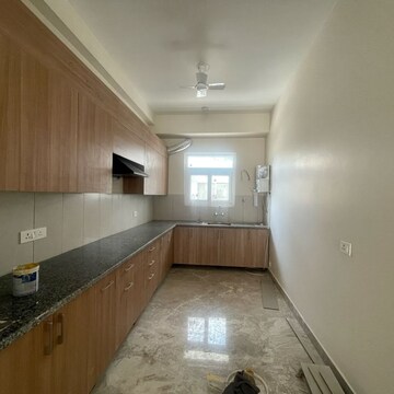 Kitchen in 3 BHK Apartment at Adani Oyster Greens, Sector 102a – for Rent