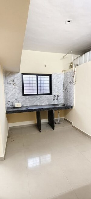 Kitchen in 1 BHK Apartment at Wadgaon Sheri – for Rent