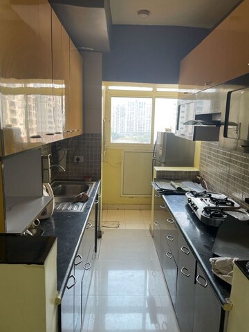 Kitchen in 3 BHK Apartment at Prateek Wisteria, Sector 77 – for Rent