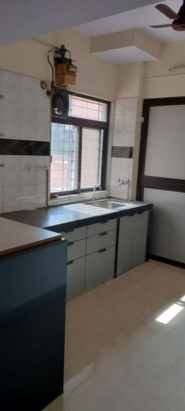 Kitchen in 1 BHK Apartment at Kanchan Pushp Society, Ghodbunder Road – for Rent