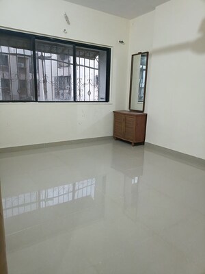 Room in 2 BHK Apartment at Rawalpada – for Rent