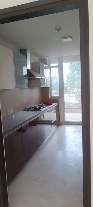 Kitchen in 3.5 BHK Apartment at Puri Diplomatic Greens Phase I, Sector 111 – for Rent