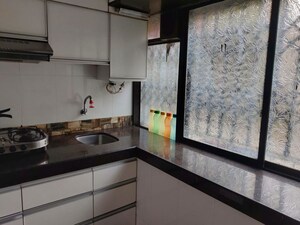 Kitchen in 2 BHK Apartment at Jumbo Darshan, Andheri East – for Rent