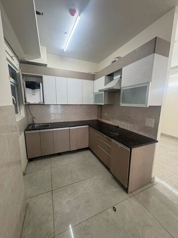 Kitchen in 4 BHK Apartment at ATS Rhapsody, Sector 1 Greater Noida – for Rent